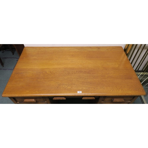 130 - An early 20th century oak pedestal desk, 77cm high x 136cm wide x 81cm deep