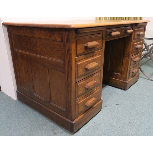 130 - An early 20th century oak pedestal desk, 77cm high x 136cm wide x 81cm deep