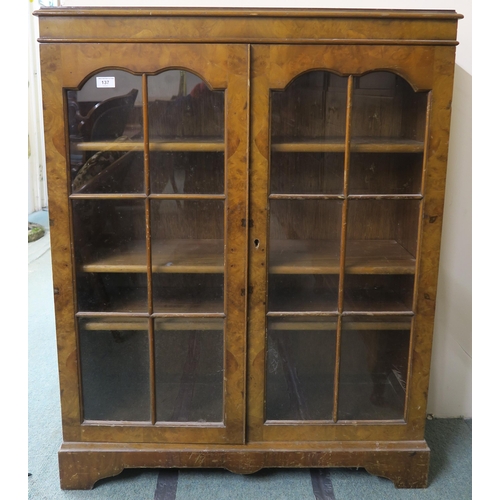 137 - A 20th century walnut veneered glazed bookcase, 112cm high x 88cm wide x 31cm deep