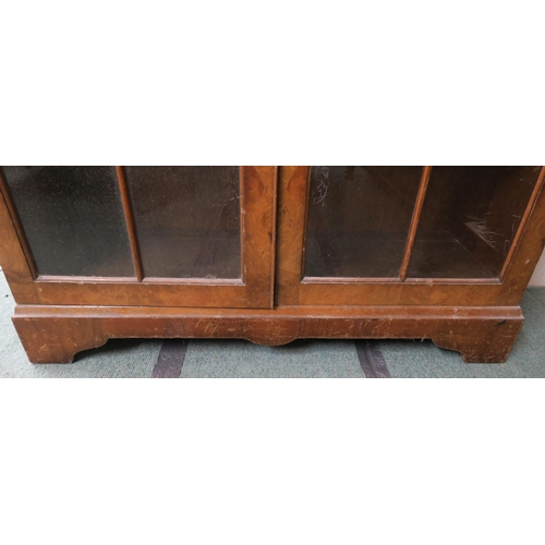 137 - A 20th century walnut veneered glazed bookcase, 112cm high x 88cm wide x 31cm deep