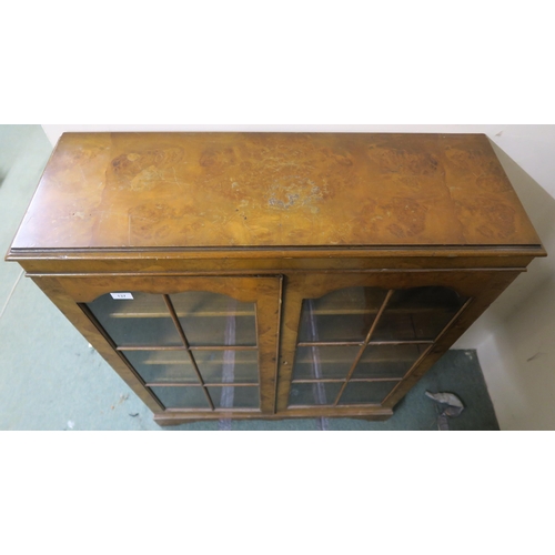 137 - A 20th century walnut veneered glazed bookcase, 112cm high x 88cm wide x 31cm deep