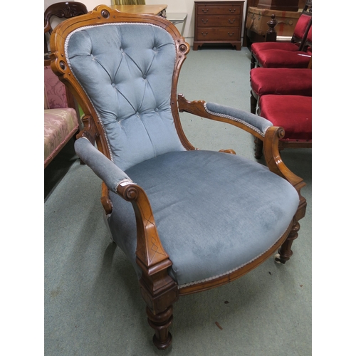 140 - A Victorian walnut framed parlour armchair with blue velour upholstery