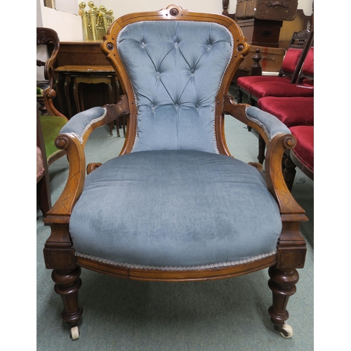 140 - A Victorian walnut framed parlour armchair with blue velour upholstery