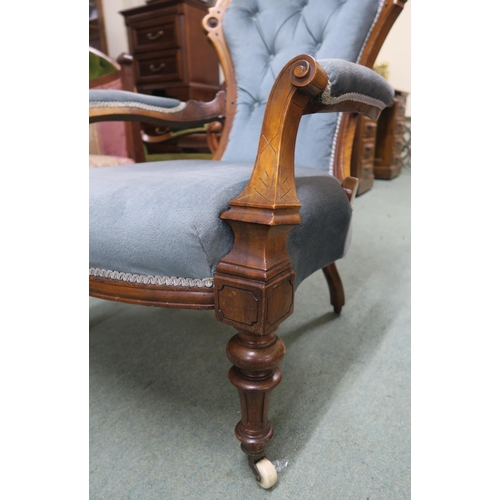 140 - A Victorian walnut framed parlour armchair with blue velour upholstery