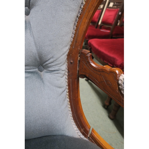 140 - A Victorian walnut framed parlour armchair with blue velour upholstery