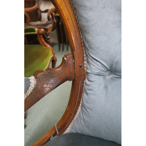 140 - A Victorian walnut framed parlour armchair with blue velour upholstery