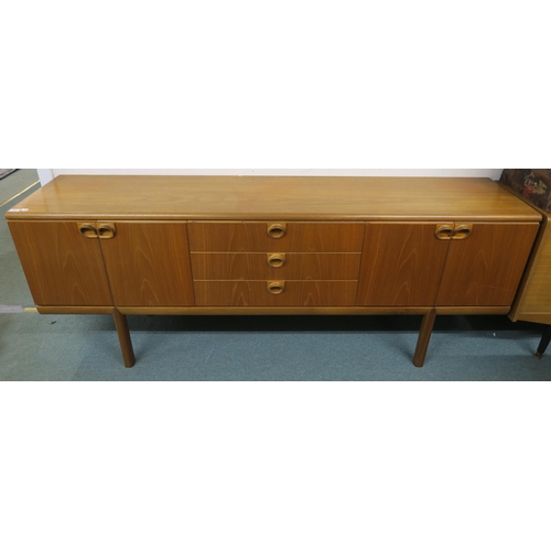 144 - A mid 20th century teak McIntosh of Kirkcaldy sideboard with three central drawers flanked by cabine... 