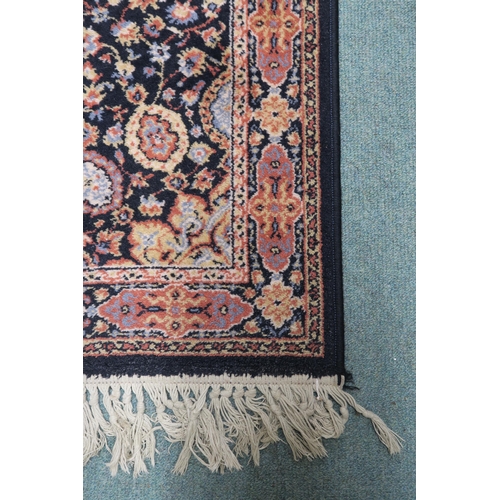 15 - A black ground eastern style rug with central medallion and matching spandrels, 157cm long x 84cm wi... 