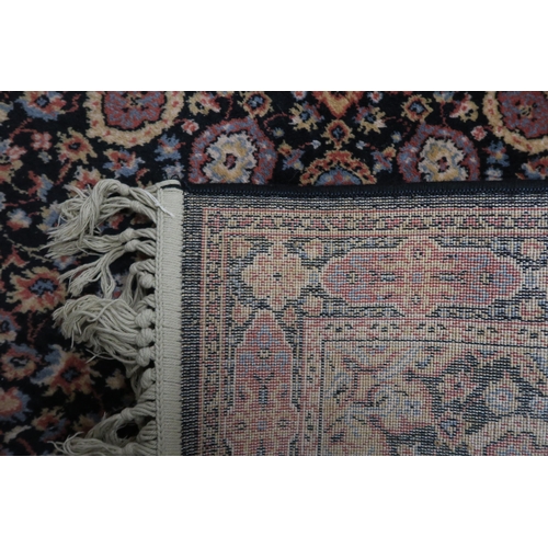 15 - A black ground eastern style rug with central medallion and matching spandrels, 157cm long x 84cm wi... 