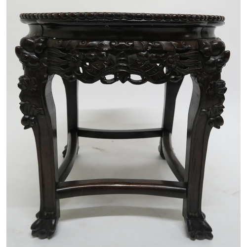 18 - An Oriental hardwood marble top occasional table