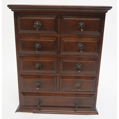 21 - A Victorian stained oak nine drawer apprentice chest, 45cm high x 37cm wide x 22cm deep