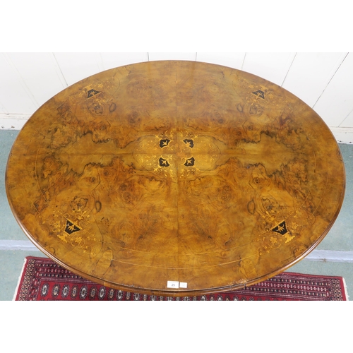 25 - A Victorian burr walnut inlaid oval tilt top breakfast table on carved quadrupedal base, 74cm high x... 