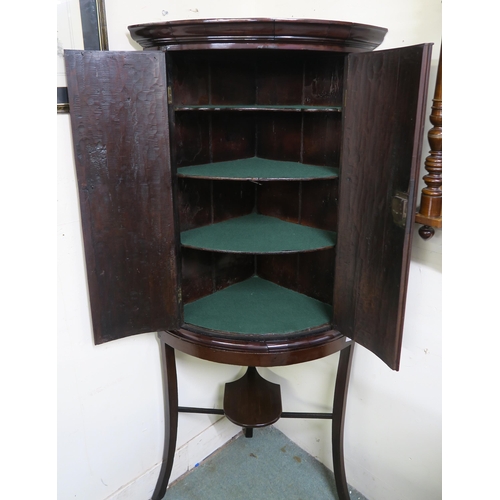 38 - A Victorian stained oak dome front two door corner cabinet on stand, 179cm high x 80cm wide x 55cm d... 