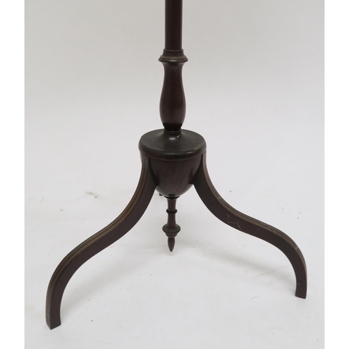 56 - A Victorian mahogany shield back pole screen and an upholstered footstool on shaped mahogany support... 