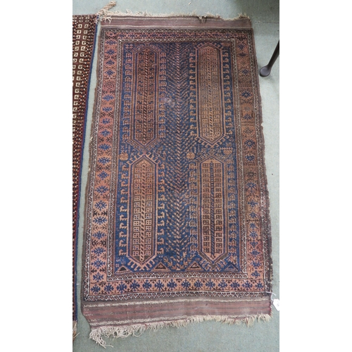 59 - A blue ground Baluch rug with terracotta borders, 164cm long x 89cm wide 