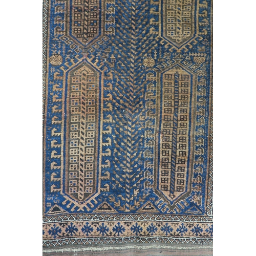 59 - A blue ground Baluch rug with terracotta borders, 164cm long x 89cm wide 