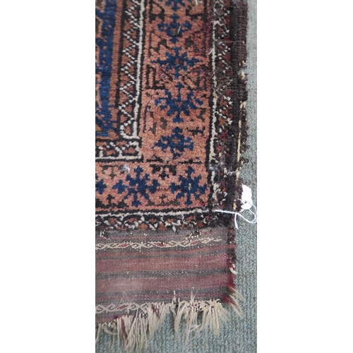 59 - A blue ground Baluch rug with terracotta borders, 164cm long x 89cm wide 