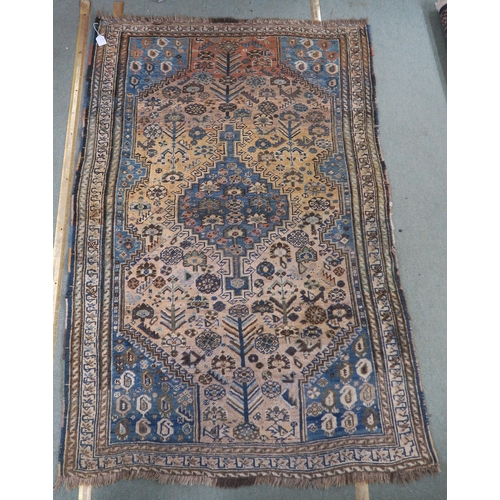 61 - A cream ground eastern rug with blue central medallion and matching spandrels, 156cm long x 110cm wi... 