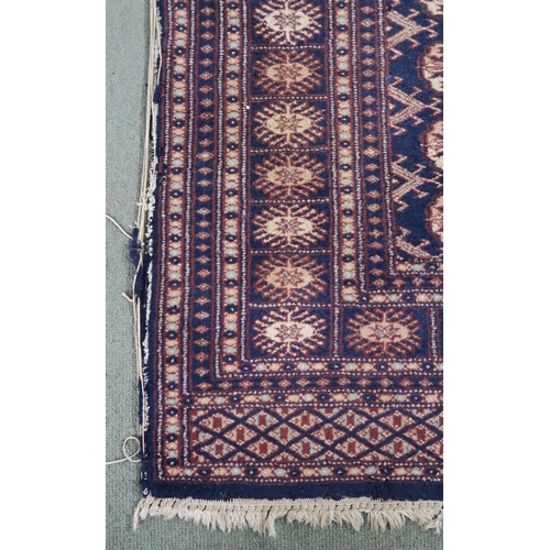 62 - A blue ground Bokhara rug with all over lozenge design, 157cm long x 100cm wide