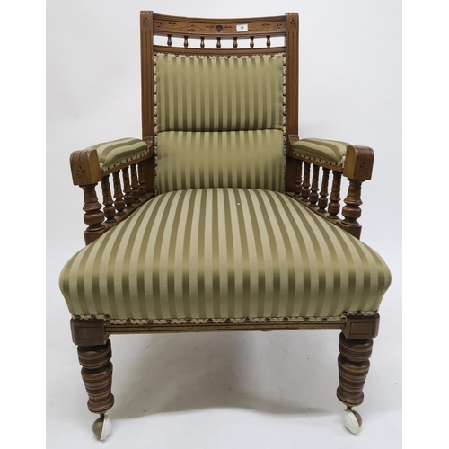 65 - A lot of two late Victorian mahogany parlour chairs one with arms, both upholstered in striped fabri... 