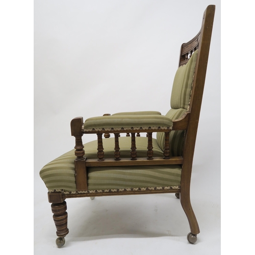 65 - A lot of two late Victorian mahogany parlour chairs one with arms, both upholstered in striped fabri... 