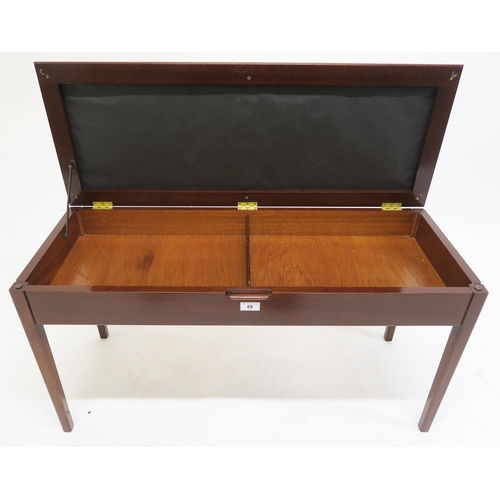 69 - A 20th century mahogany upholstered piano stool with hinged top, 54cm high x 94cm wide x 36cm deep