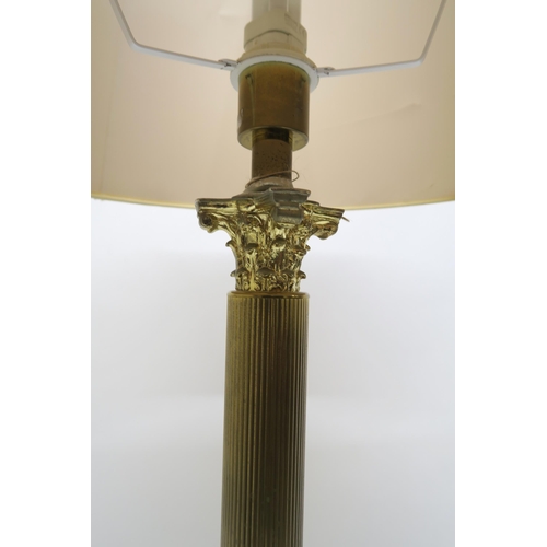 70 - A 20th century brass Corinthian column style standard lamp, 157cm high and another mahogany standard... 