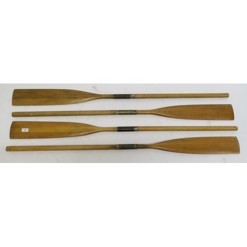 74 - A lot of four teak oars, 141cm long