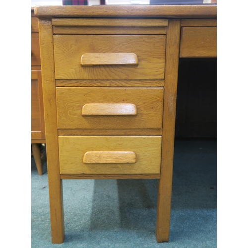 75 - An early 20th century oak desk, 78cm high x 153cm wide x 92cm deep