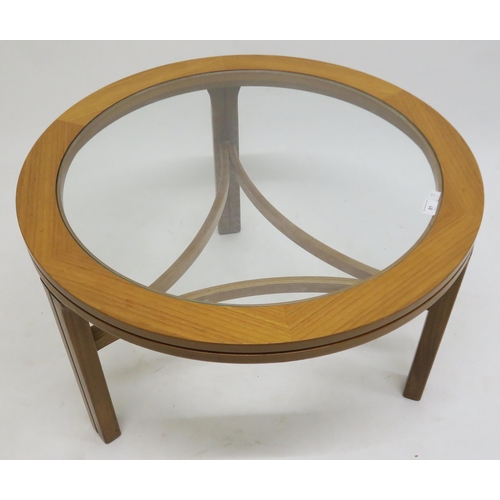 81 - A mid 20th century Nathan teak glazed circular coffee table, 50cm high x 82cm diameter