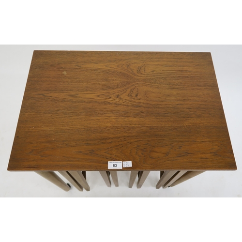 83 - A mid 20th century teak nesting table with four circular drop leaf tables after Poul Hundevad, 56cm ... 