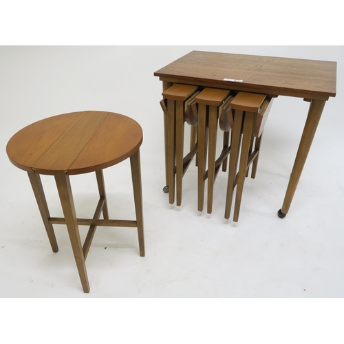 83 - A mid 20th century teak nesting table with four circular drop leaf tables after Poul Hundevad, 56cm ... 