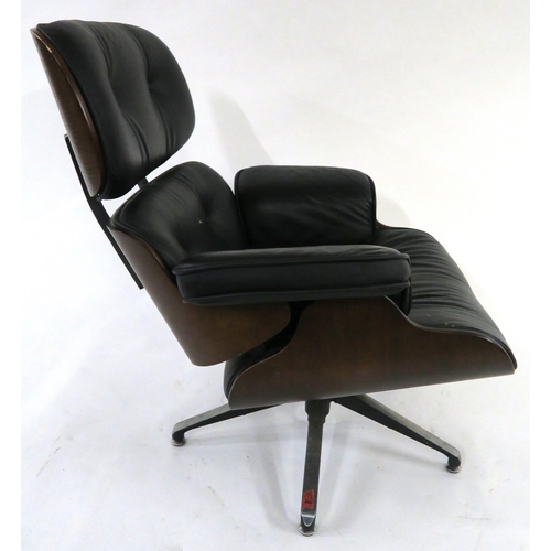 104 - A 20TH CENTURY REVOLVING LOUNGE CHAIR AND FOOTSTOOL IN THE STYLE OF CHARLES AND RAY EAMES FOR HERMAN... 