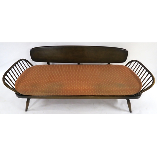 105 - A MID 20TH CENTURY STAINED ELM & BEECH ERCOL 355 DAY BED 77cm high x 209cm wide x 76cm deep... 