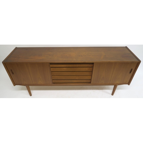 109 - A MID 20TH CENTURY TEAK NILS JONSSON FOR TROEDS SIDEBOARDwith five central drawers flanked by slidin... 