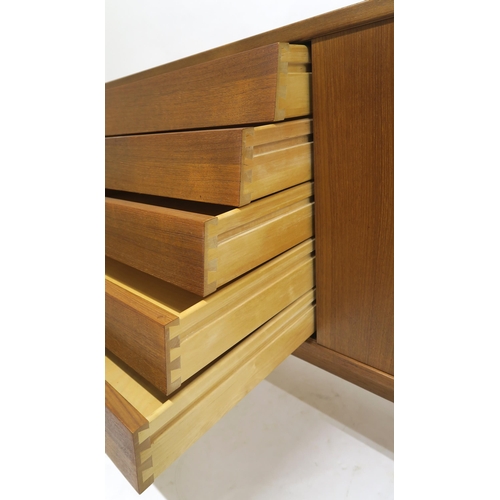 109 - A MID 20TH CENTURY TEAK NILS JONSSON FOR TROEDS SIDEBOARDwith five central drawers flanked by slidin... 