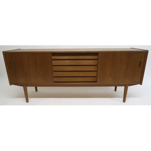 109 - A MID 20TH CENTURY TEAK NILS JONSSON FOR TROEDS SIDEBOARDwith five central drawers flanked by slidin... 