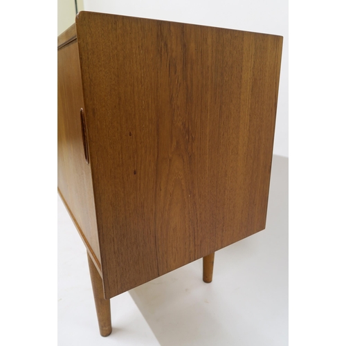 109 - A MID 20TH CENTURY TEAK NILS JONSSON FOR TROEDS SIDEBOARDwith five central drawers flanked by slidin... 