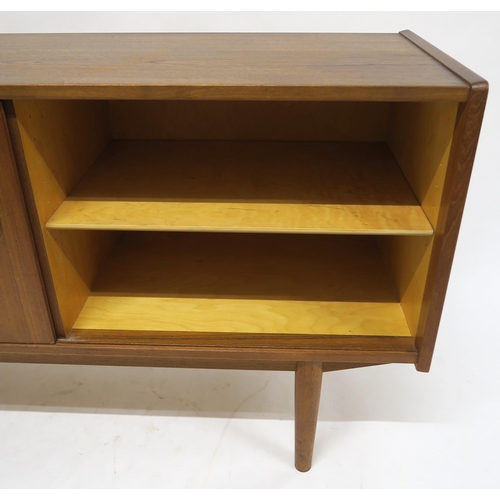 109 - A MID 20TH CENTURY TEAK NILS JONSSON FOR TROEDS SIDEBOARDwith five central drawers flanked by slidin... 