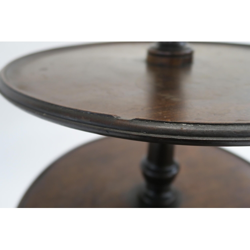 11 - A GEORGE III MAHOGANY THREE TIER DUMB WAITER with circular graduating tiers on a baluster stem and t... 