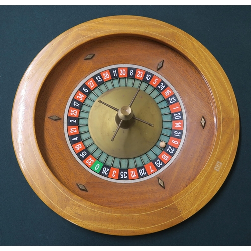 112 - A 20TH CENTURY FRENCH CASINO ROULETTE TABLE PRODUCED BY CARO OF PARIS, baize shaped top, mahogany an... 