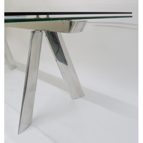 114 - A CONTEMPORARY ROCHE BOBOIS CHRONOS GLASS AND CHROME EXTENDING DINING TABLE,75cm high x 220cm long (... 