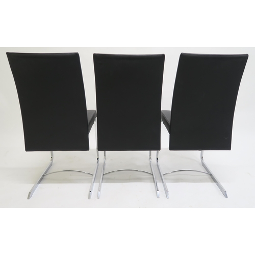 115 - A SET OF EIGHT ROCHE BOBOIS CHRONOS BLACK LEATHER UPHOLSTERED RECLINING DINING CHAIRS,with chrome ba... 