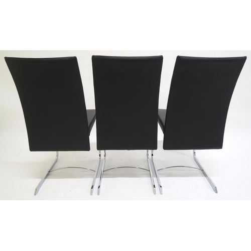 115 - A SET OF EIGHT ROCHE BOBOIS CHRONOS BLACK LEATHER UPHOLSTERED RECLINING DINING CHAIRS,with chrome ba... 