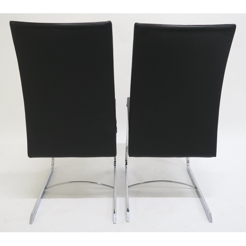 115 - A SET OF EIGHT ROCHE BOBOIS CHRONOS BLACK LEATHER UPHOLSTERED RECLINING DINING CHAIRS,with chrome ba... 