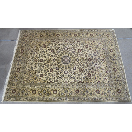 120 - A CREAM GROUND PERSIAN HAND KNOTTED FINE KASHAN RUG with central medallion and matching spandrels 34... 