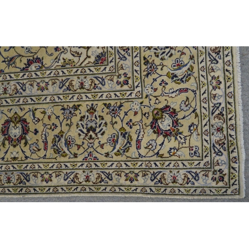 120 - A CREAM GROUND PERSIAN HAND KNOTTED FINE KASHAN RUG with central medallion and matching spandrels 34... 