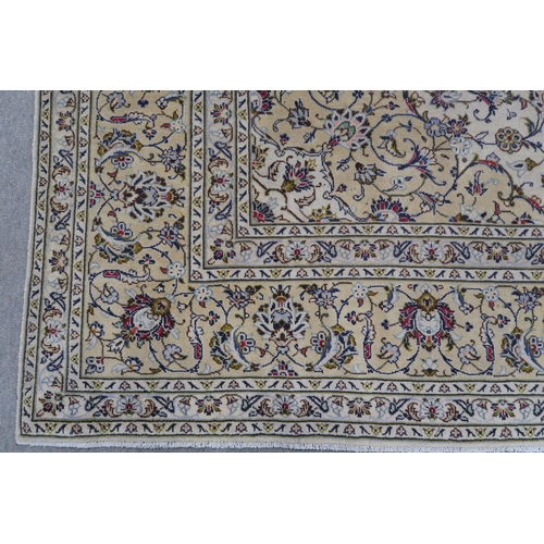 120 - A CREAM GROUND PERSIAN HAND KNOTTED FINE KASHAN RUG with central medallion and matching spandrels 34... 