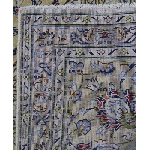 120 - A CREAM GROUND PERSIAN HAND KNOTTED FINE KASHAN RUG with central medallion and matching spandrels 34... 