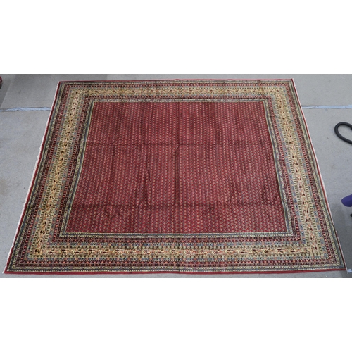 125 - A RED GROUND ARAAK RUG with multicoloured geometric borders 370cm long x 283cm wide... 